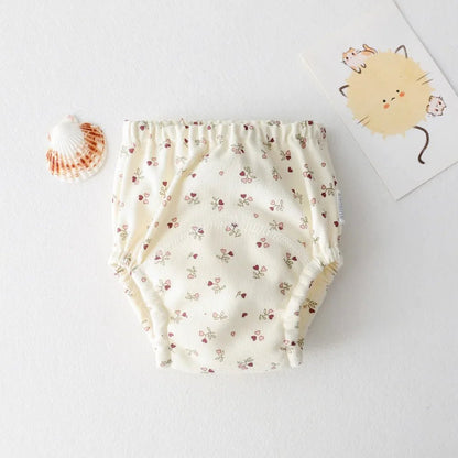 Culotte d'apprentissage - KIDEE Élégante et confortable, cette culotte d’apprentissage avec motif fleuri est parfaite pour une transition sereine vers le pot. Sa matière 100 % coton respecte la peau délicate de bébé.