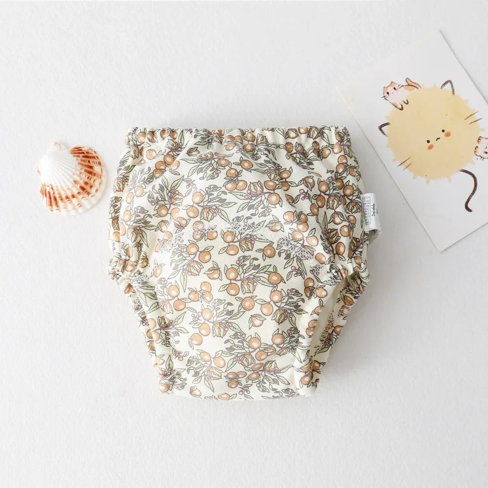 Culotte d'apprentissage - KIDEE Réutilisable et lavable, cette culotte d’apprentissage en coton avec motif orange aide votre enfant à devenir propre tout en limitant les déchets.