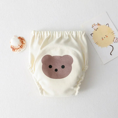 Culotte d'apprentissage - KIDEE Offrez à votre enfant une transition en douceur vers la propreté avec cette culotte d’apprentissage en coton 100 % naturel. Son joli motif ourson et sa texture douce assurent confort et absorption pour des journées sans stress.